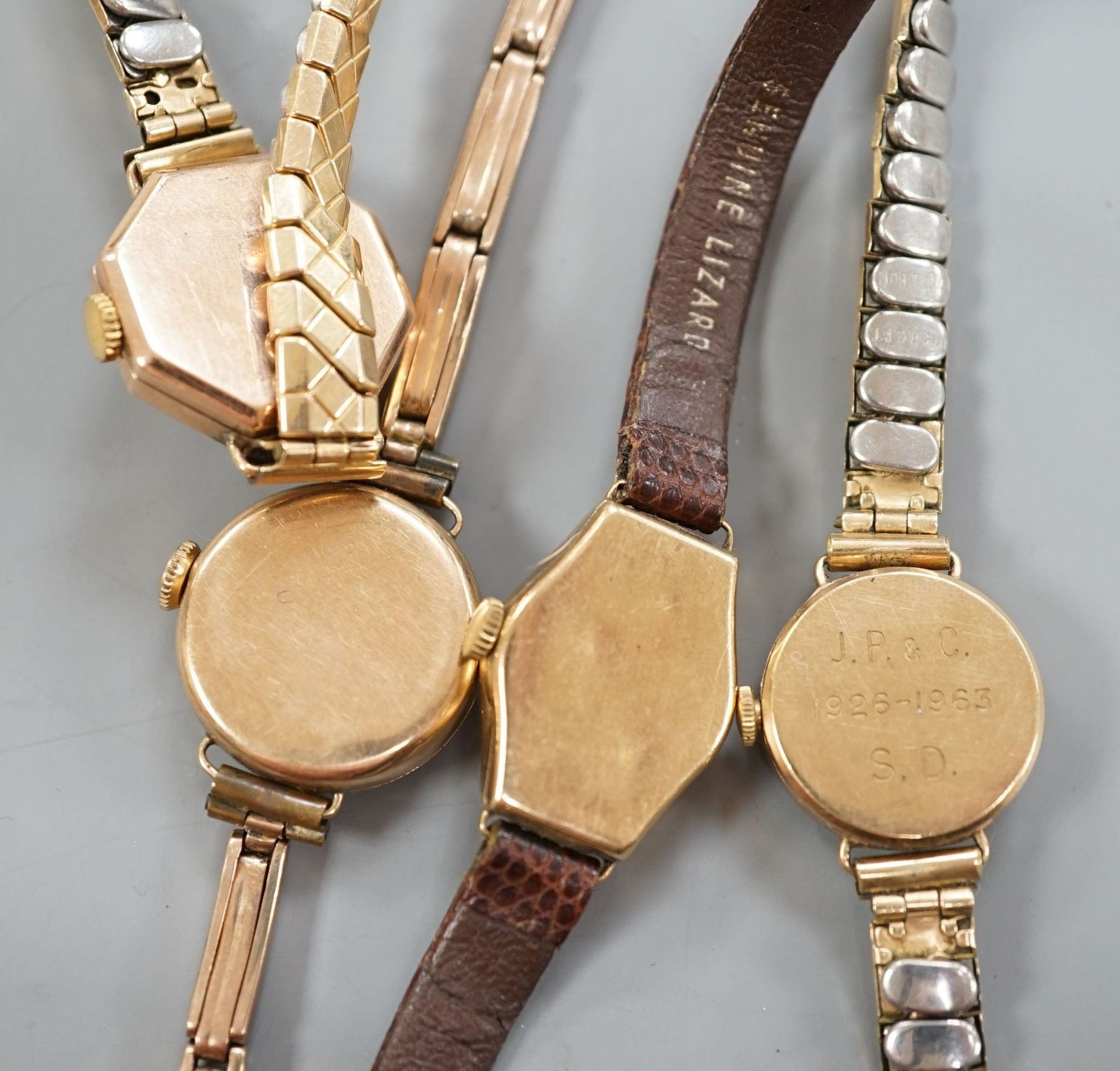 Three lady's early to mid 20th century 9ct gold manual wind wrist watches, one on a 9ct bracelet and one other yellow metal wrist watch